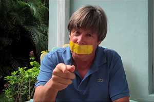 Still of Dave Barry silenced by yellow tape